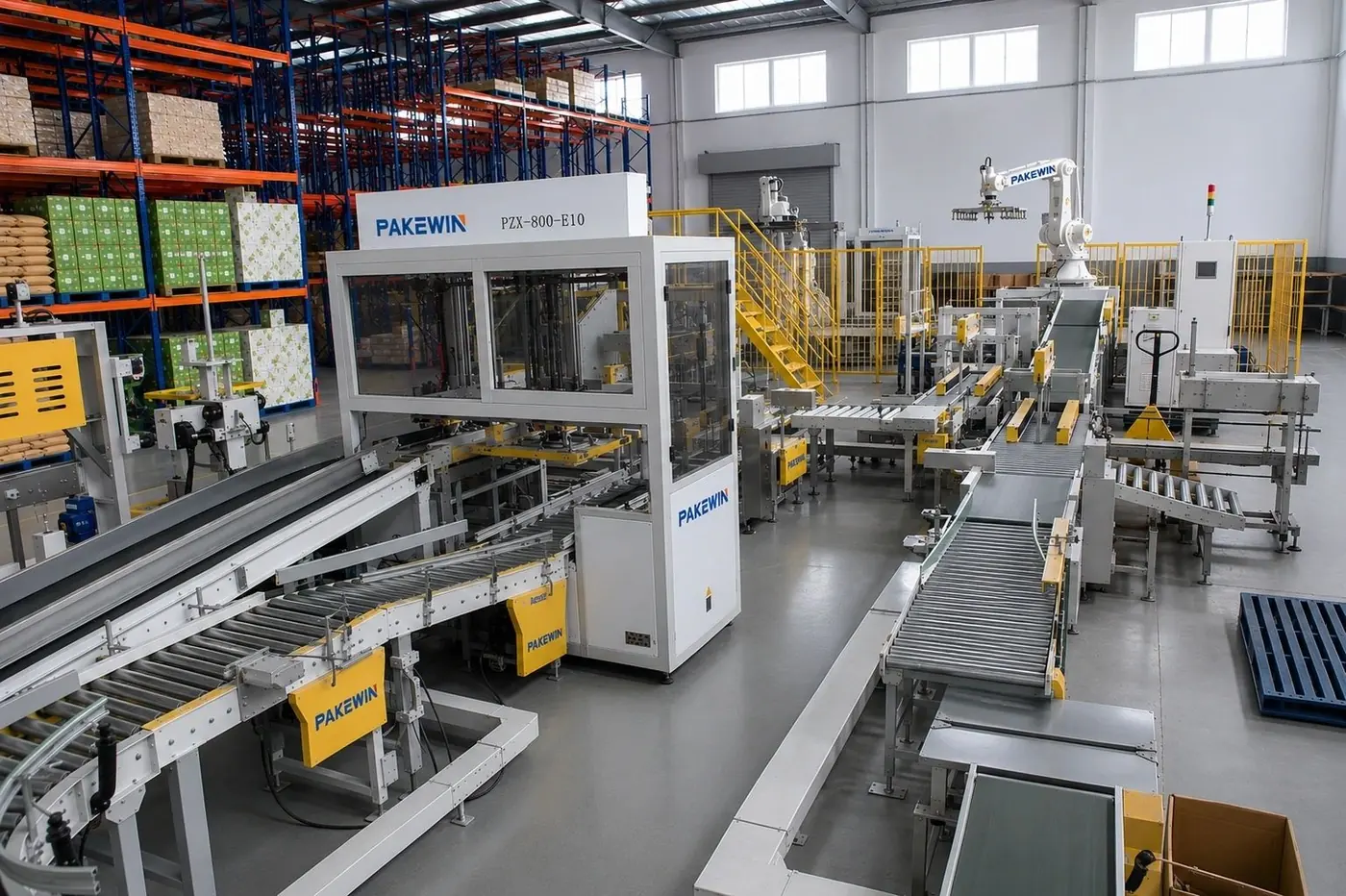 A real PAKEWIN downstream packaging line with case handling, conveyors and robotic palletizing equipment.